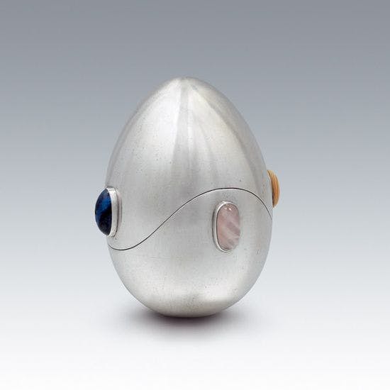 Das Osterei by Koloman Moser, 1905. [A futuristic-looking egg, made of metallic silver with different colored jewels inset.]